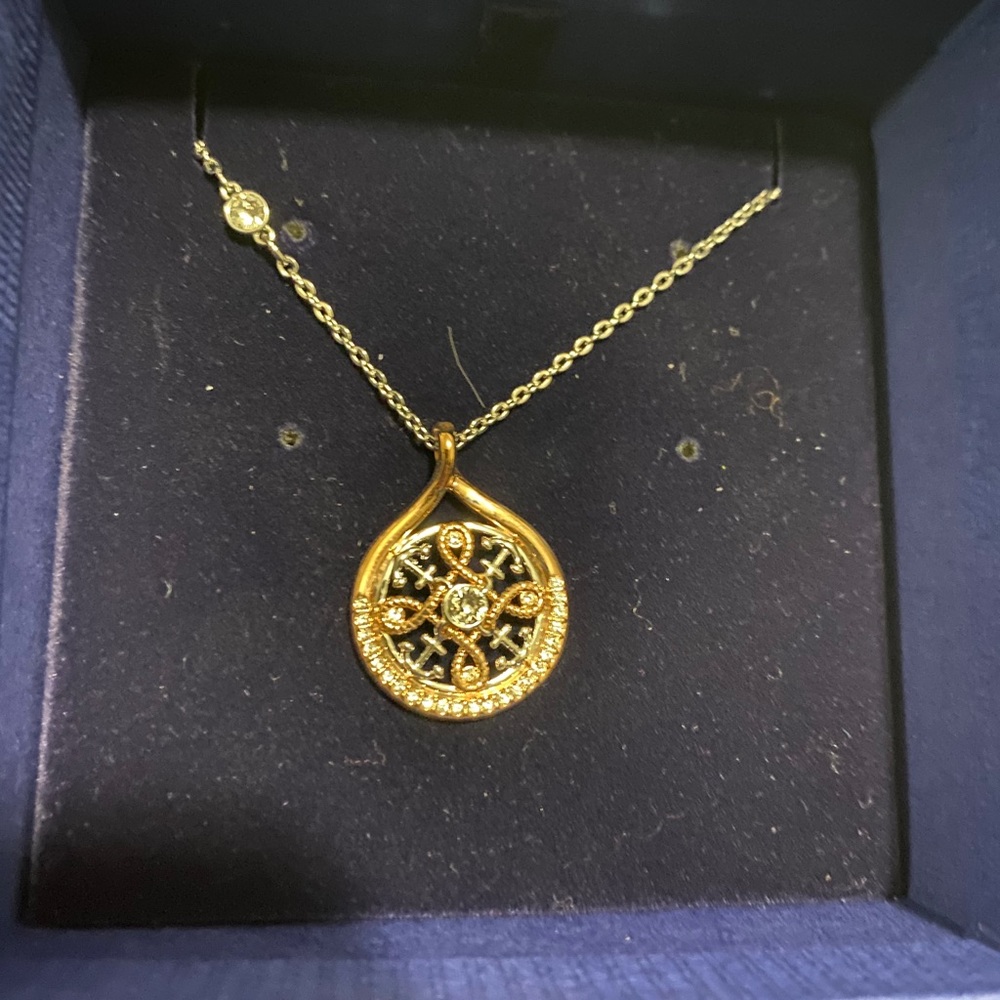 Swarovski compass necklace.